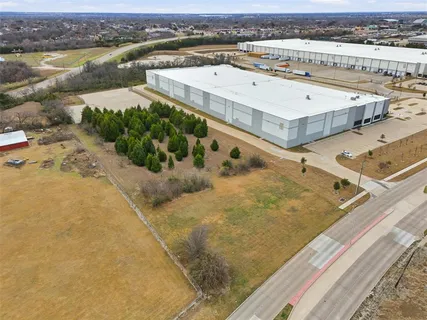 an aerial view of a house with a lake view