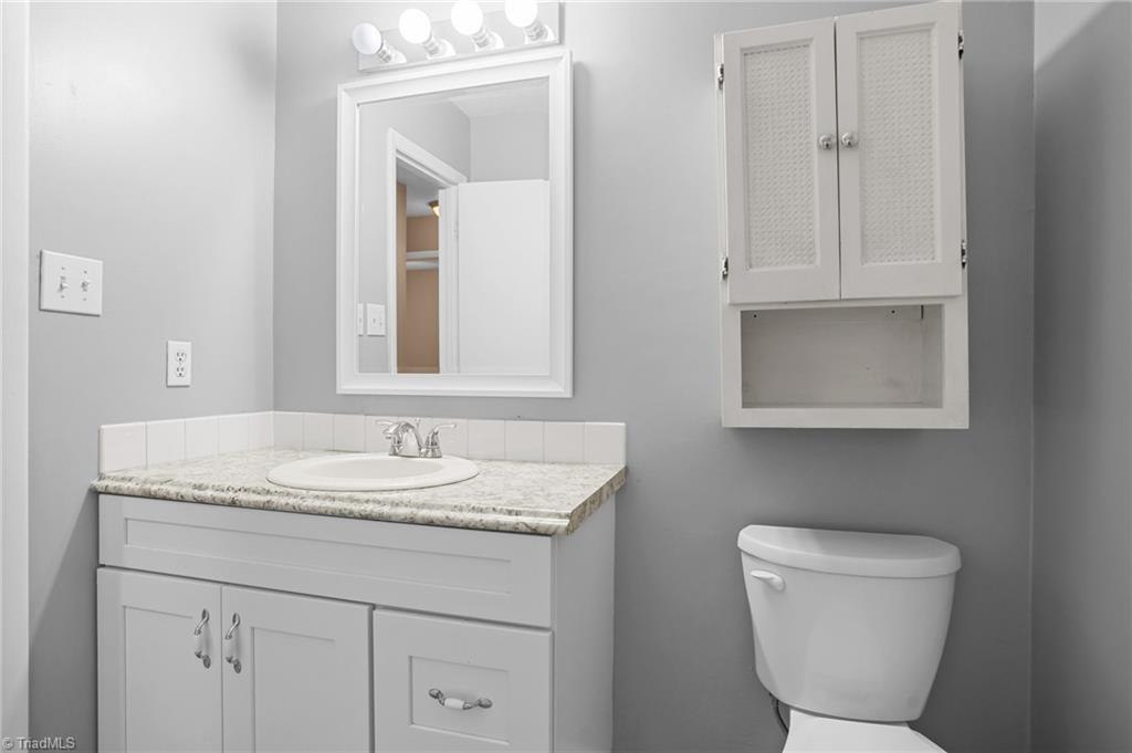 1405 Pepper Hill Road Greensboro, NC 27407 - Photo 30 of 50 Newer vanities and toilets