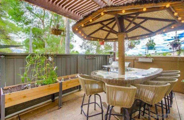 a view of an outdoor sitting area with swimming pool