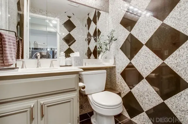 a bathroom with a toilet and a sink