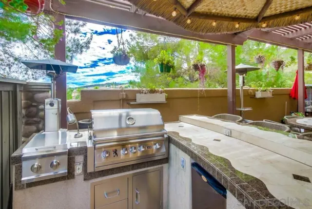 a stove top oven sitting next to a window