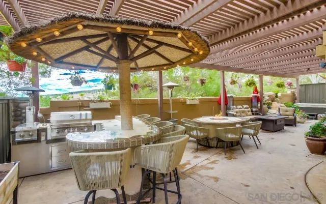 a patio with a table and chairs