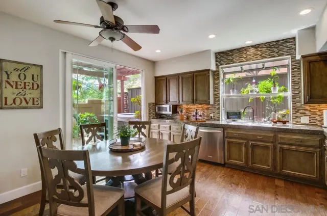 a view of a dining room with furniture window and outside view