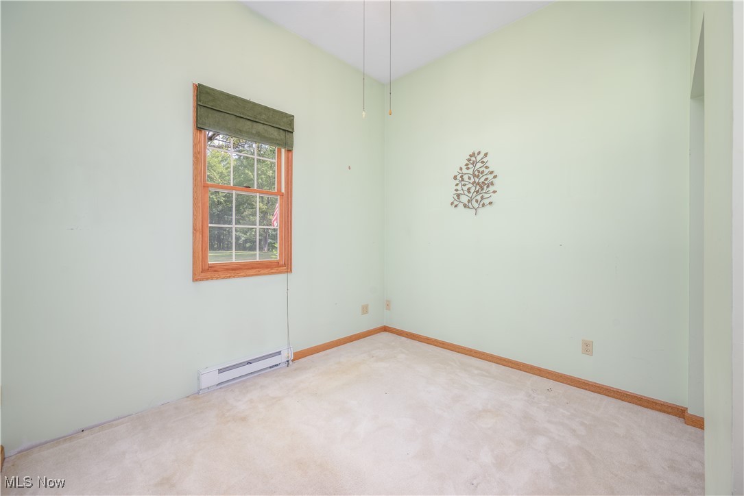 6640 Giddings Road Rootstown, OH 44272 - Photo 40 of 49 Empty room with baseboard heating and light carpet