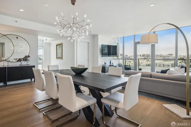 a view of a dining room with furniture window and wooden floor