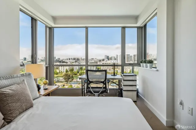 a view of a city from a dining room with large windows