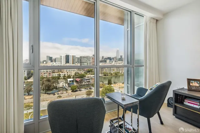 a bedroom with bed and wooden floor