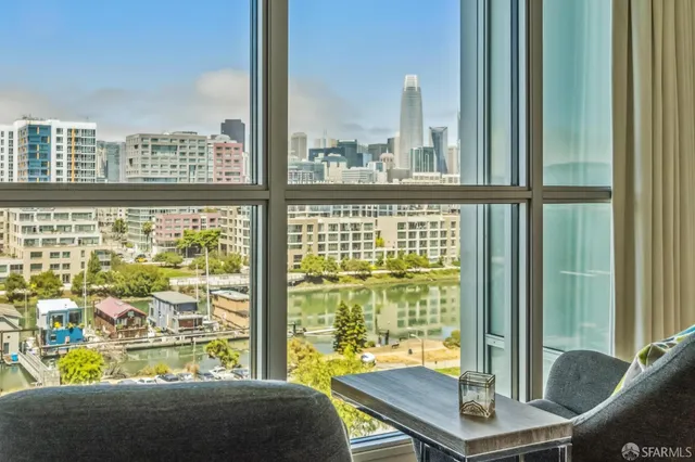 a bathroom with a granite countertop sink mirror toilet and bathtub