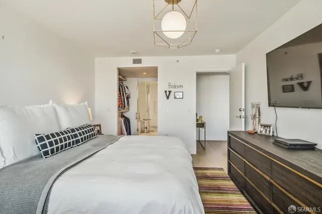 a view of a patio with couches table and chairs and potted plants