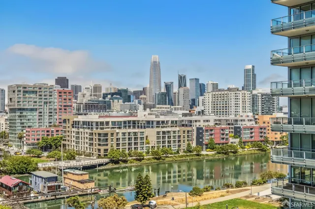a view of a lake with tall buildings