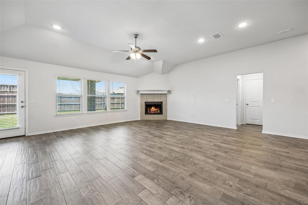 3807 Dogwood Road Melissa, TX 75454 - Photo 18 of 38 a view of an empty room with a fireplace and a window
