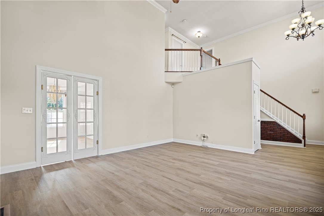 106 Linden Road Cameron, NC 28326 - Photo 8 of 48 a view of an empty room with wooden floor and a window