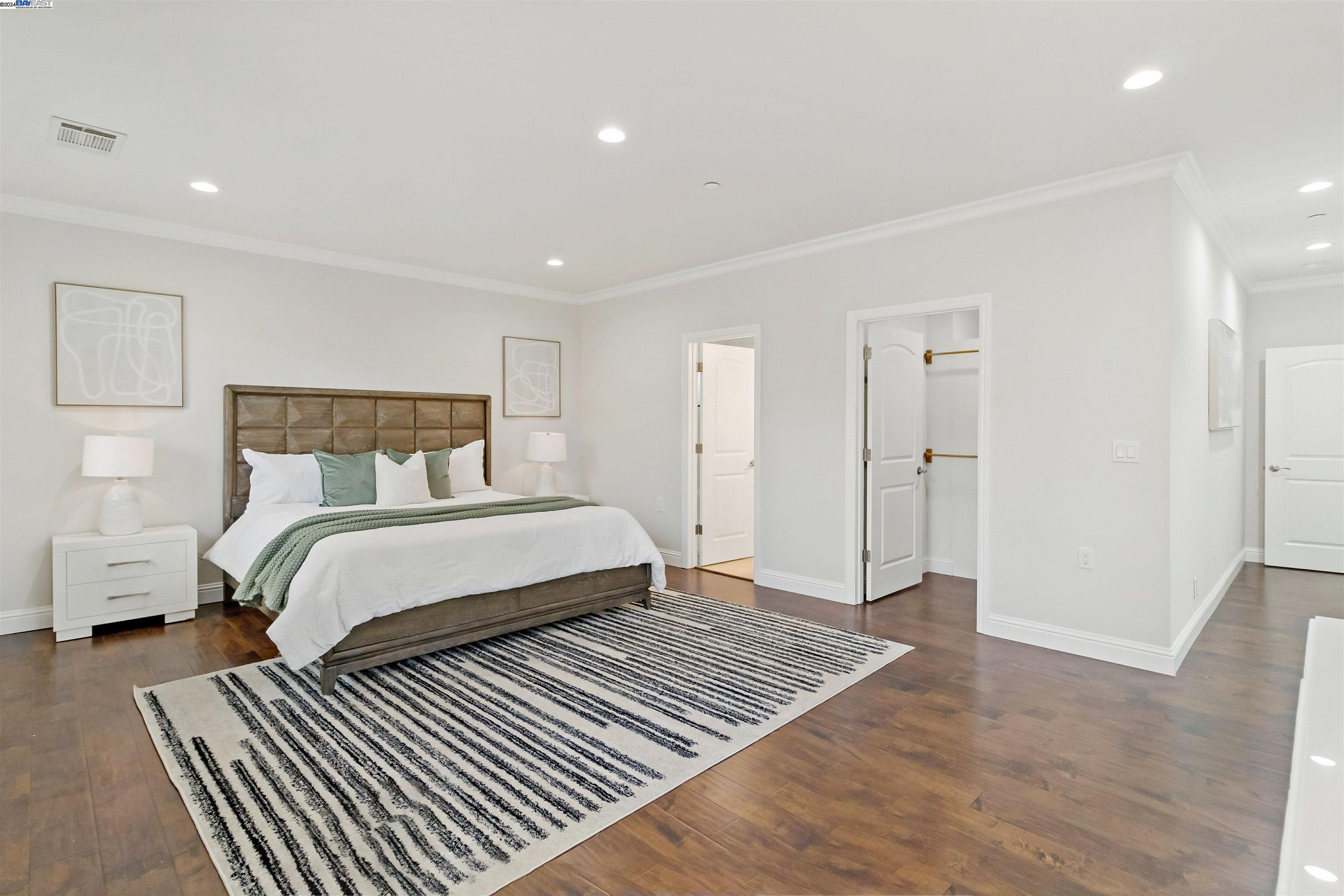 Warm Springs Fremont, CA 94539 - Photo 13 of 27 a bedroom with a bed and wooden floor