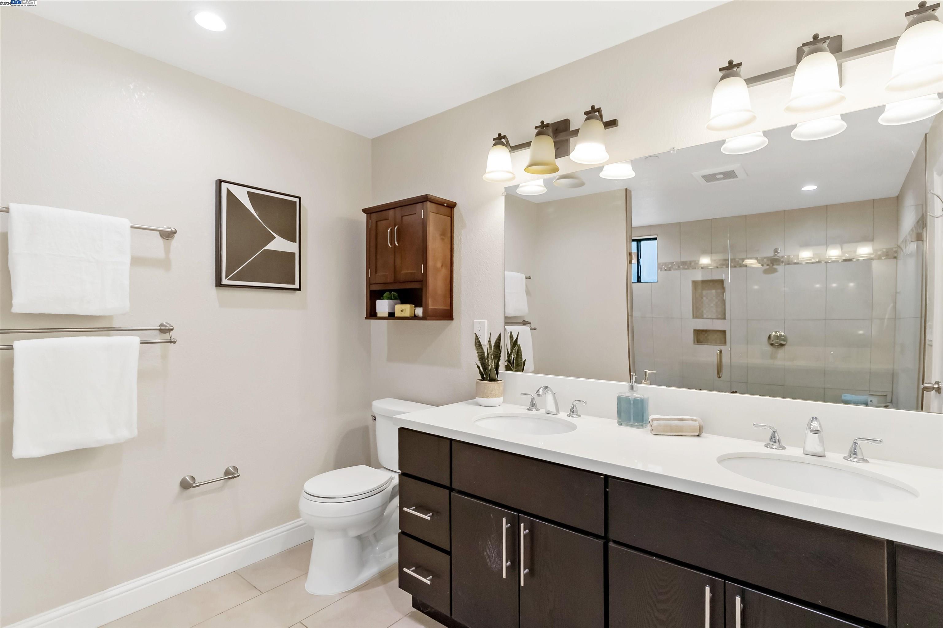 Warm Springs Fremont, CA 94539 - Photo 15 of 27 a bathroom with a double vanity sink mirror and toilet