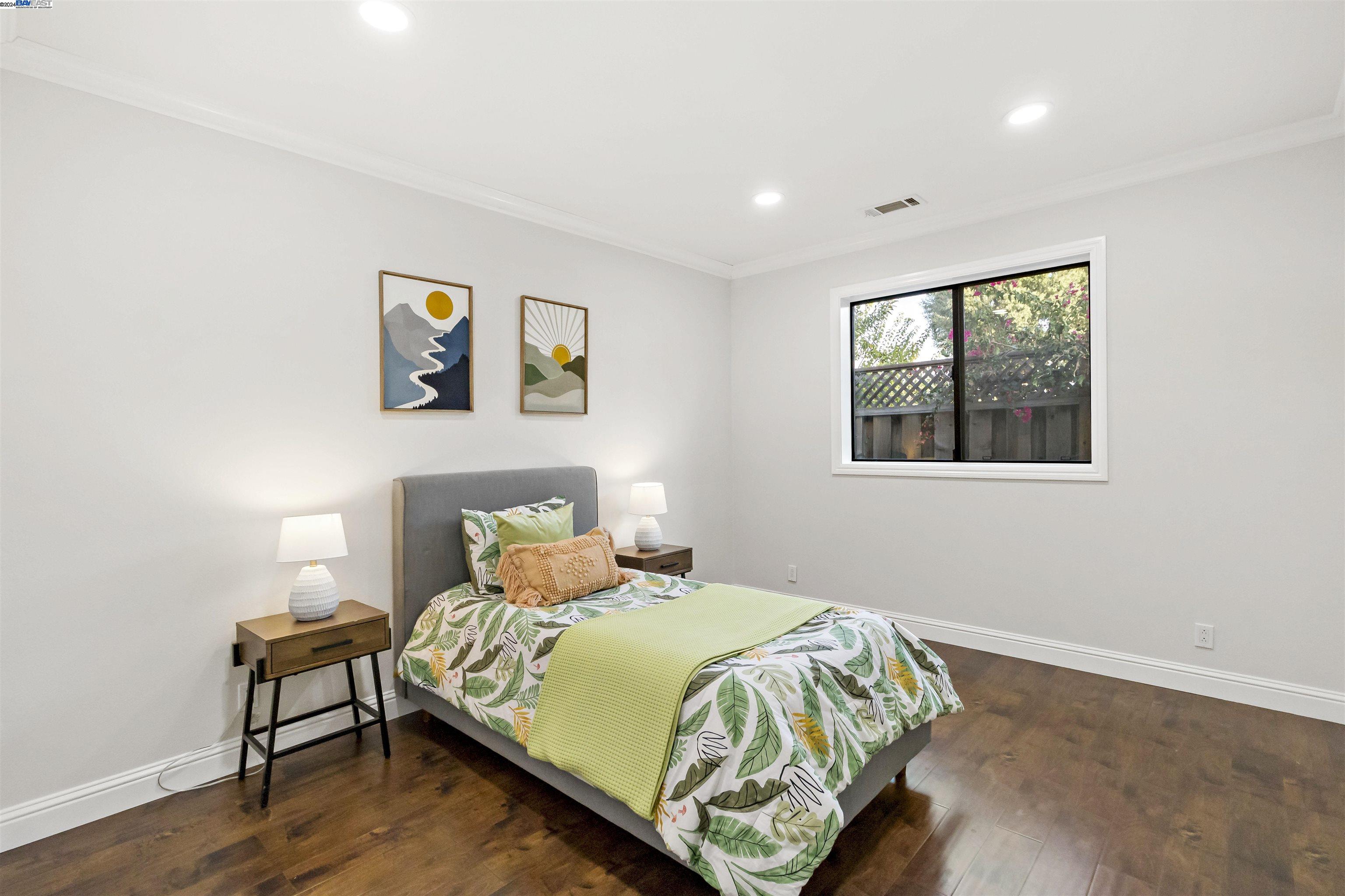 Warm Springs Fremont, CA 94539 - Photo 21 of 27 a bedroom with a bed and wooden floor
