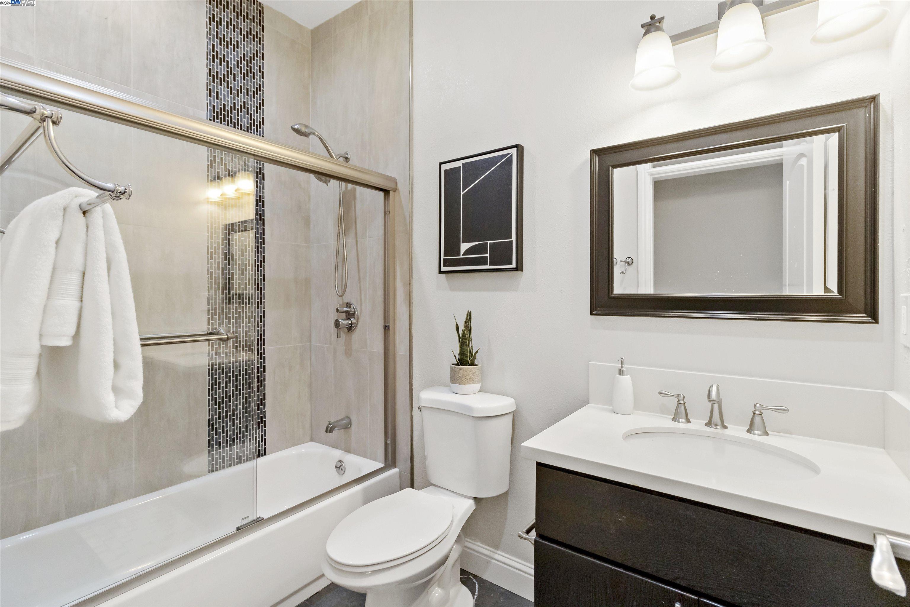 Warm Springs Fremont, CA 94539 - Photo 23 of 27 a bathroom with a toilet a sink and a bathtub