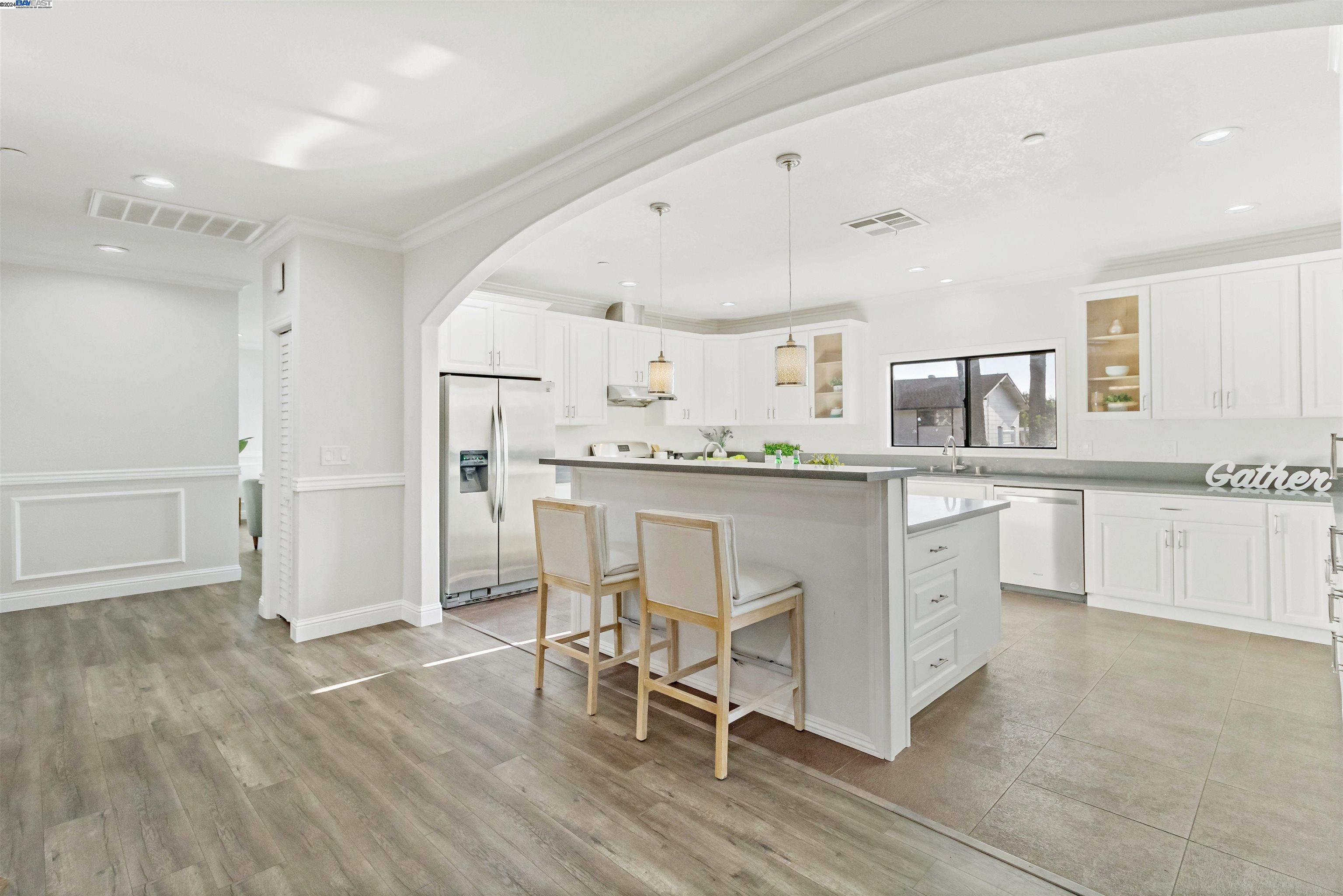 Warm Springs Fremont, CA 94539 - Photo 7 of 27 a kitchen with granite countertop cabinets a table and chairs