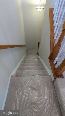 a view of wooden floor and windows in a room