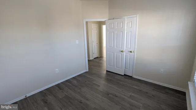 a bathroom with a tub a window and a shower