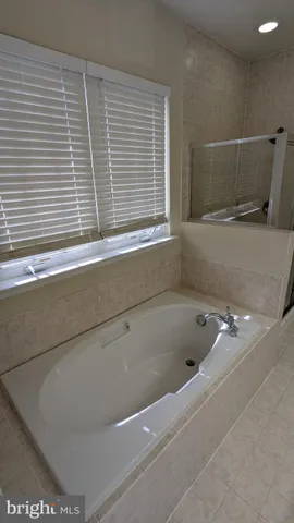 a close view of a bathtub in bathroom