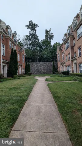 a view of a park with a house