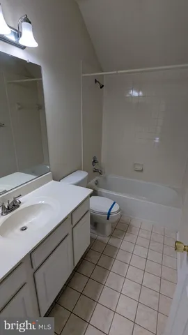 a view of a balcony with wooden floor and fence