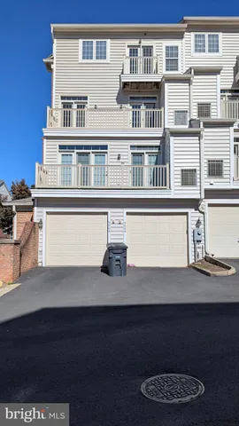 a kitchen with granite countertop a refrigerator and a sink
