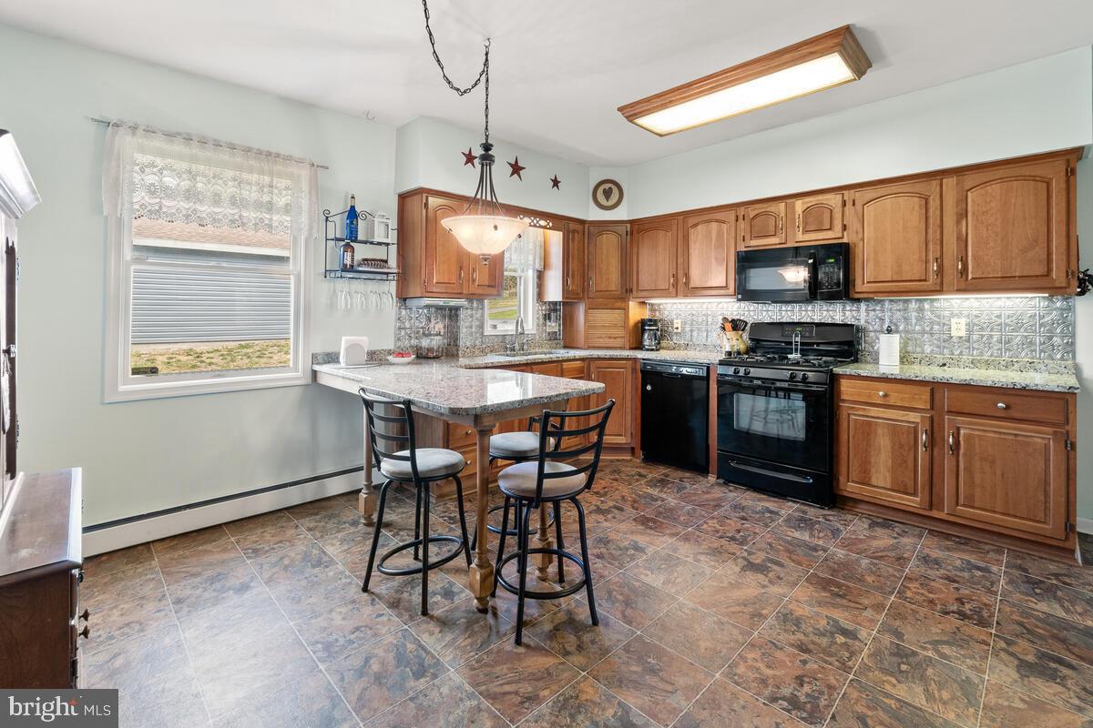 25526 Military Road Cascade, MD 21719 - Photo 12 of 59 Gas range, granite counters