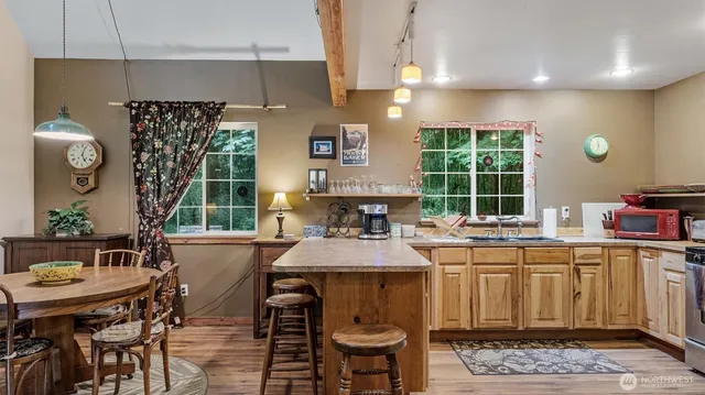 a kitchen with a table and chairs in it