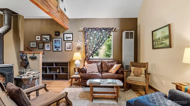 a living room with furniture a lamp and a fireplace