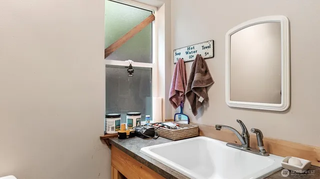 a bathroom with a sink and mirror