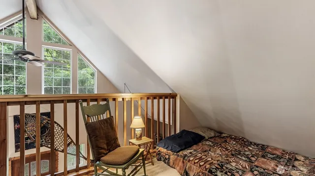 a bedroom with two beds and a window