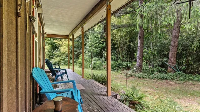 a house view with swimming pool in front of it