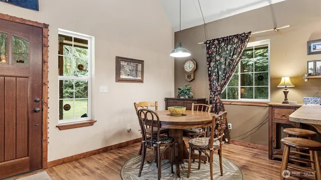 a view of a dining room with furniture and window