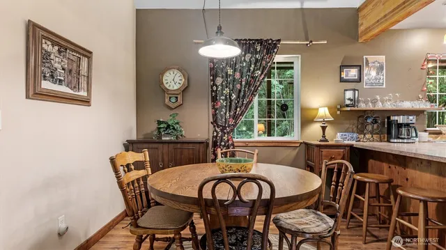 a view of a dining room with furniture and chandelier