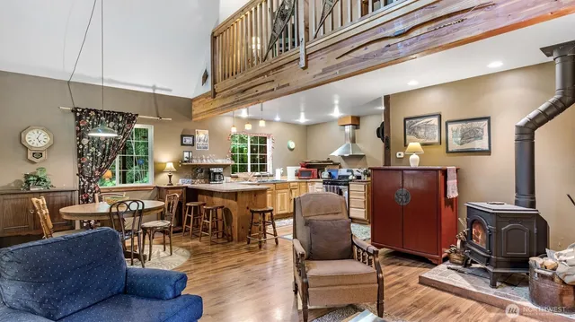 a living room with lots of furniture and kitchen view