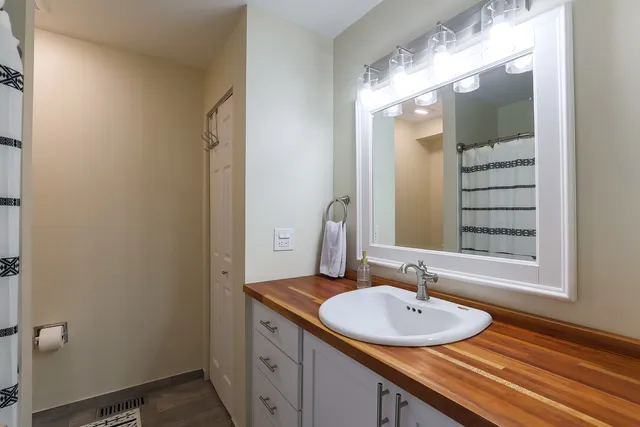 a bathroom with a sink and a mirror