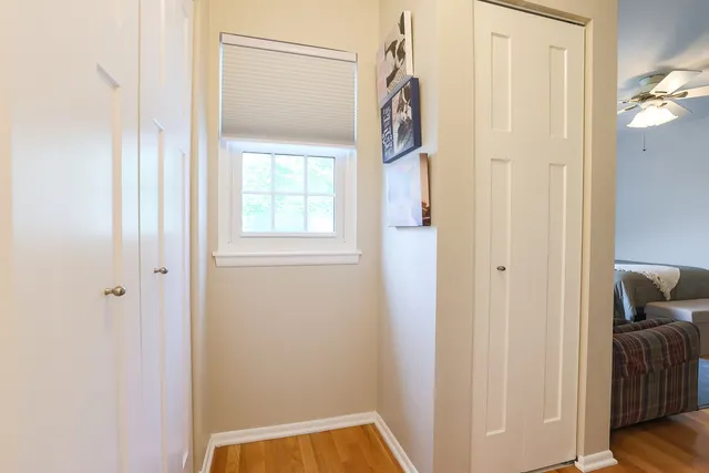 a view of front door with wooden floor