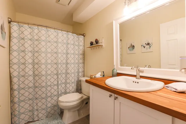 a bathroom with a sink and toilet