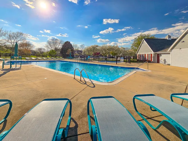 a view of a swimming pool with seating area