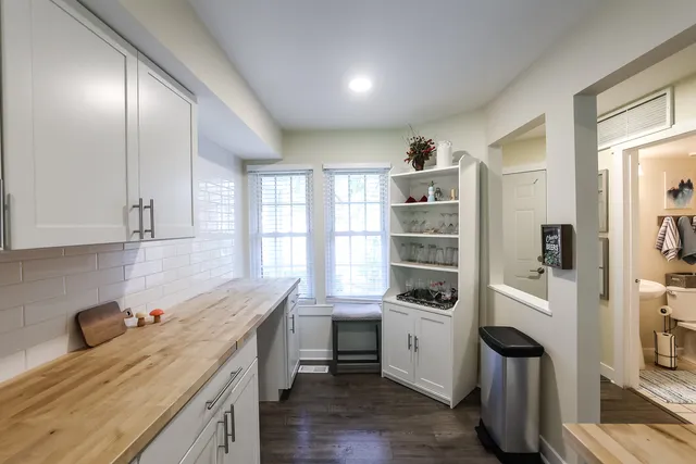 a kitchen with a refrigerator oven and a sink
