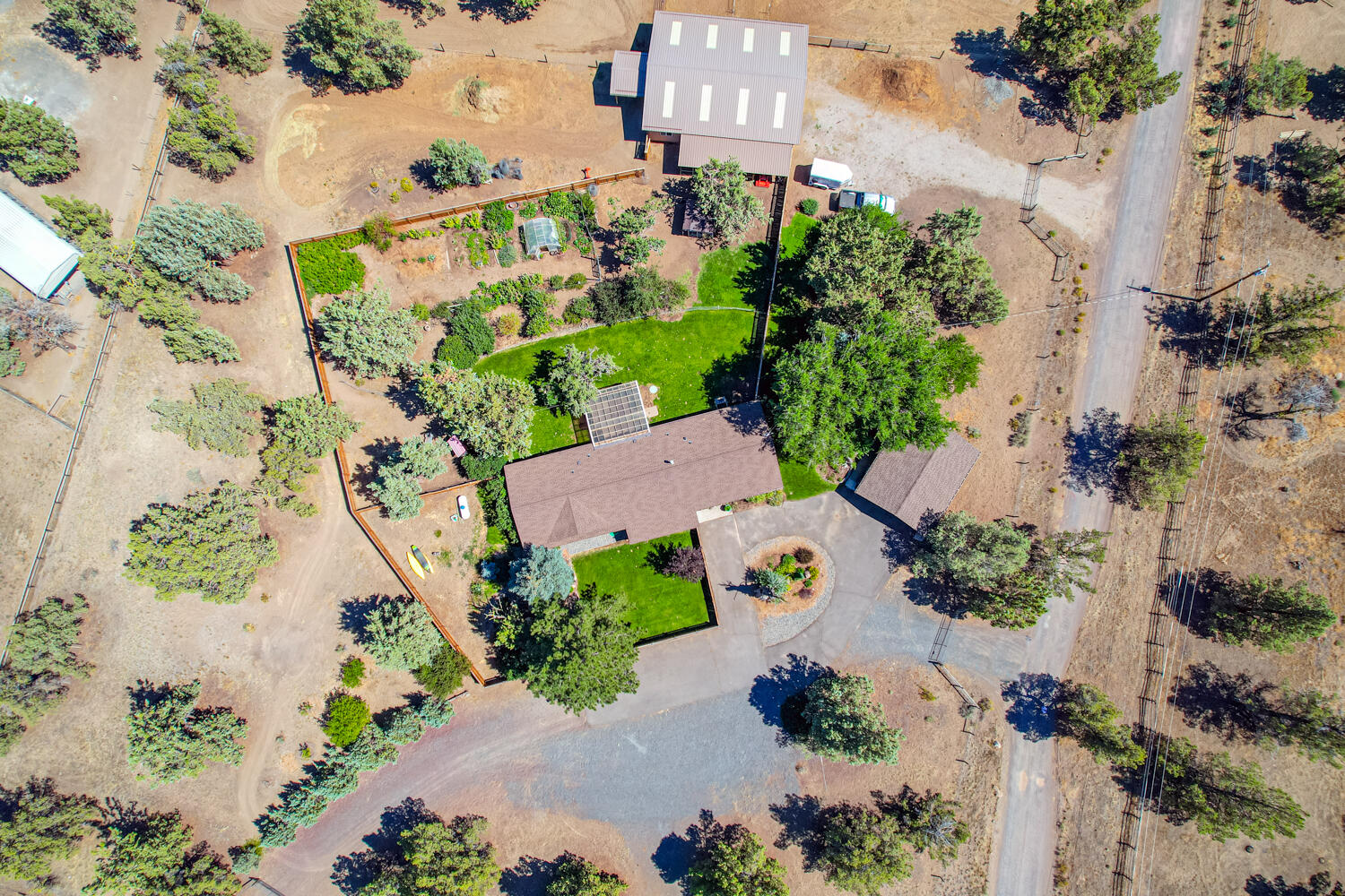 2218 Southwest 79th Street Redmond, OR 97756 - Photo 33 of 54 an aerial view of a house with a yard and garden space
