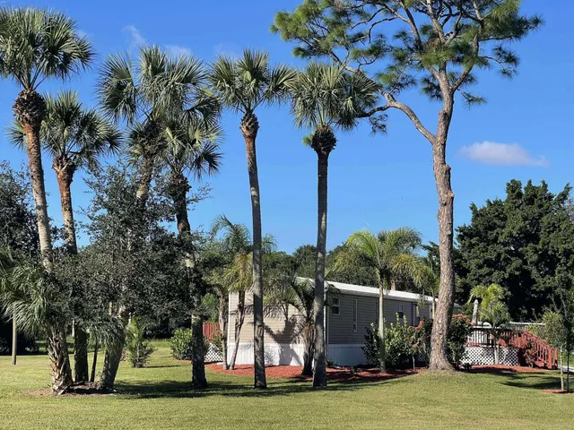 a view of a swimming pool with a table and chairs