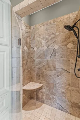 a bathroom with a shower and a toilet