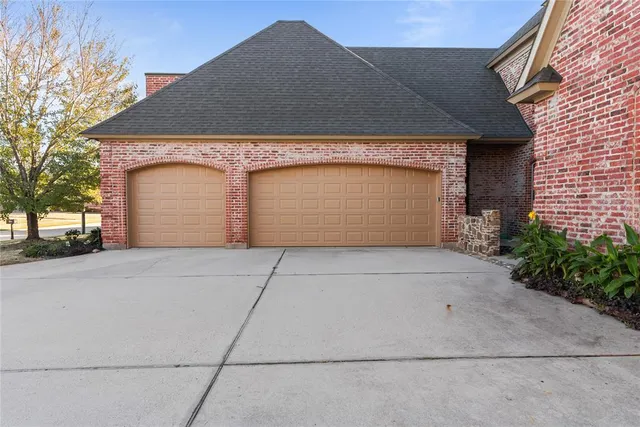 a front view of a house with a garage