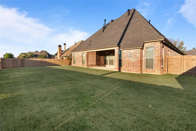 a backyard of a house with lots of green space