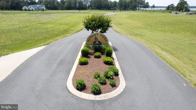 a view of a lake with a floor to ceiling window