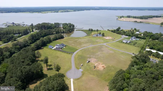 an aerial view of a house with a lake view