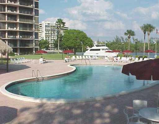 859 Jeffery Street, Unit 702 Boca Raton, FL 33487 - Photo 1 of 40 a view of a swimming pool and a yard
