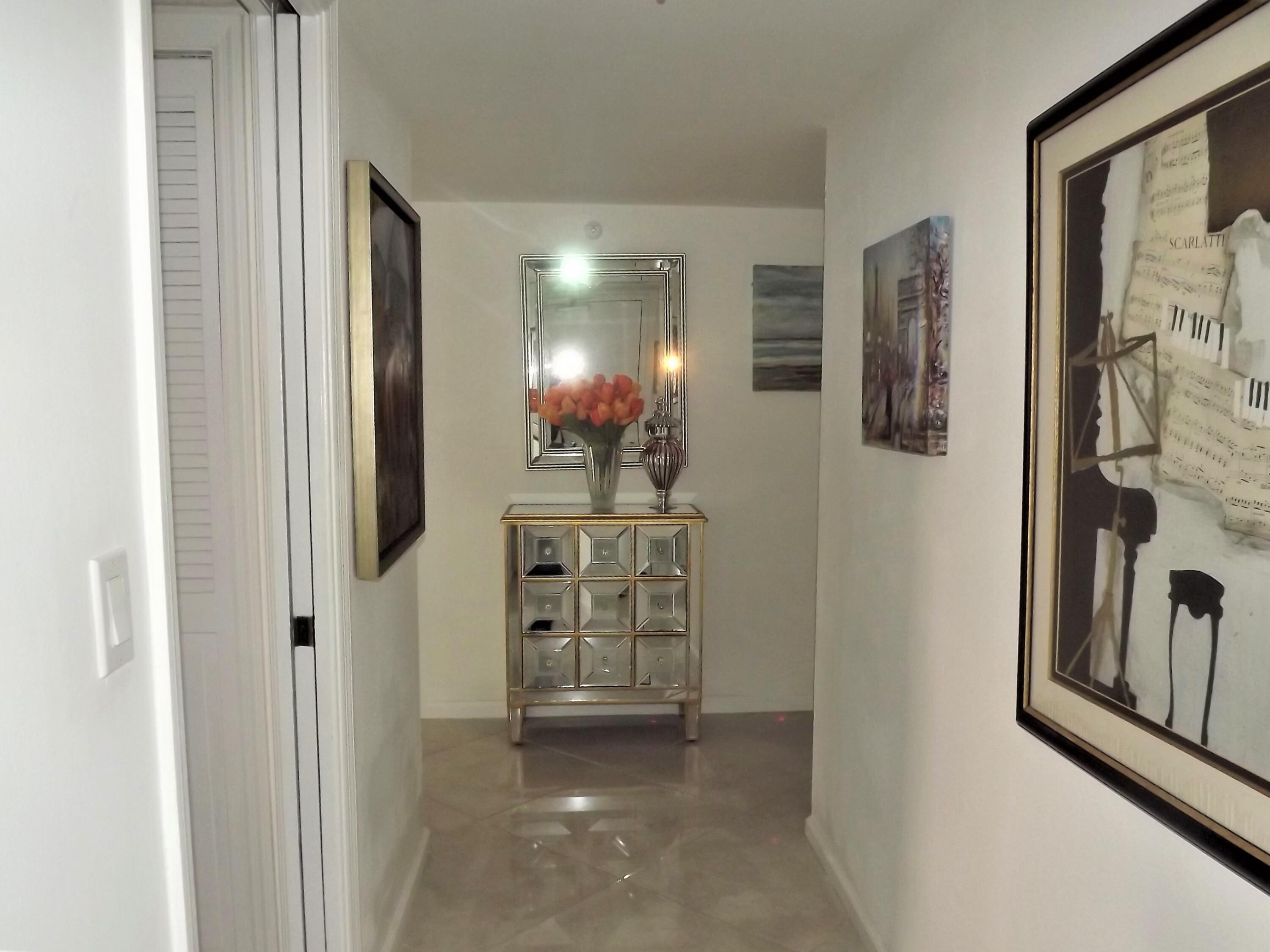 859 Jeffery Street, Unit 702 Boca Raton, FL 33487 - Photo 12 of 40 a view of a bathroom with mirror and shower